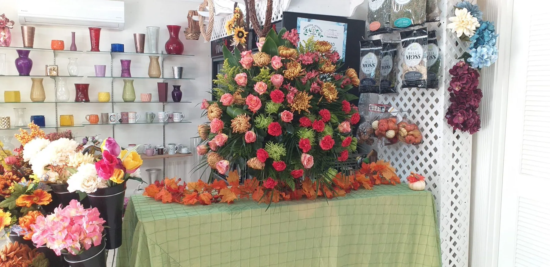 Large rose arrangement on a table inside the Creative Avenues flower shop on Market Street South, Nassau